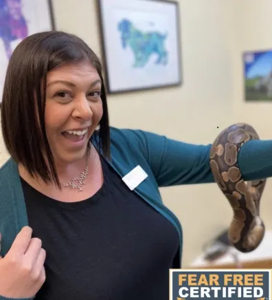 Alicia holding a snake on her arm